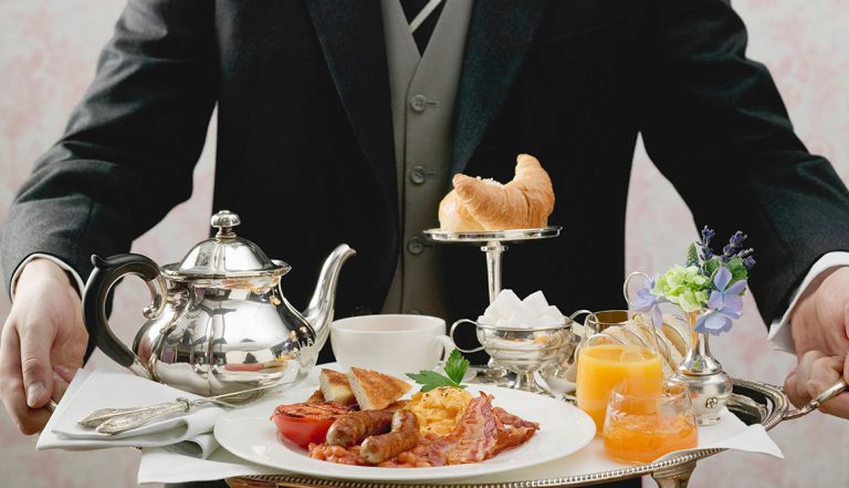 BC5WWA Butler serving English breakfast on tray -. Image shot 2007. Exact date unknown.